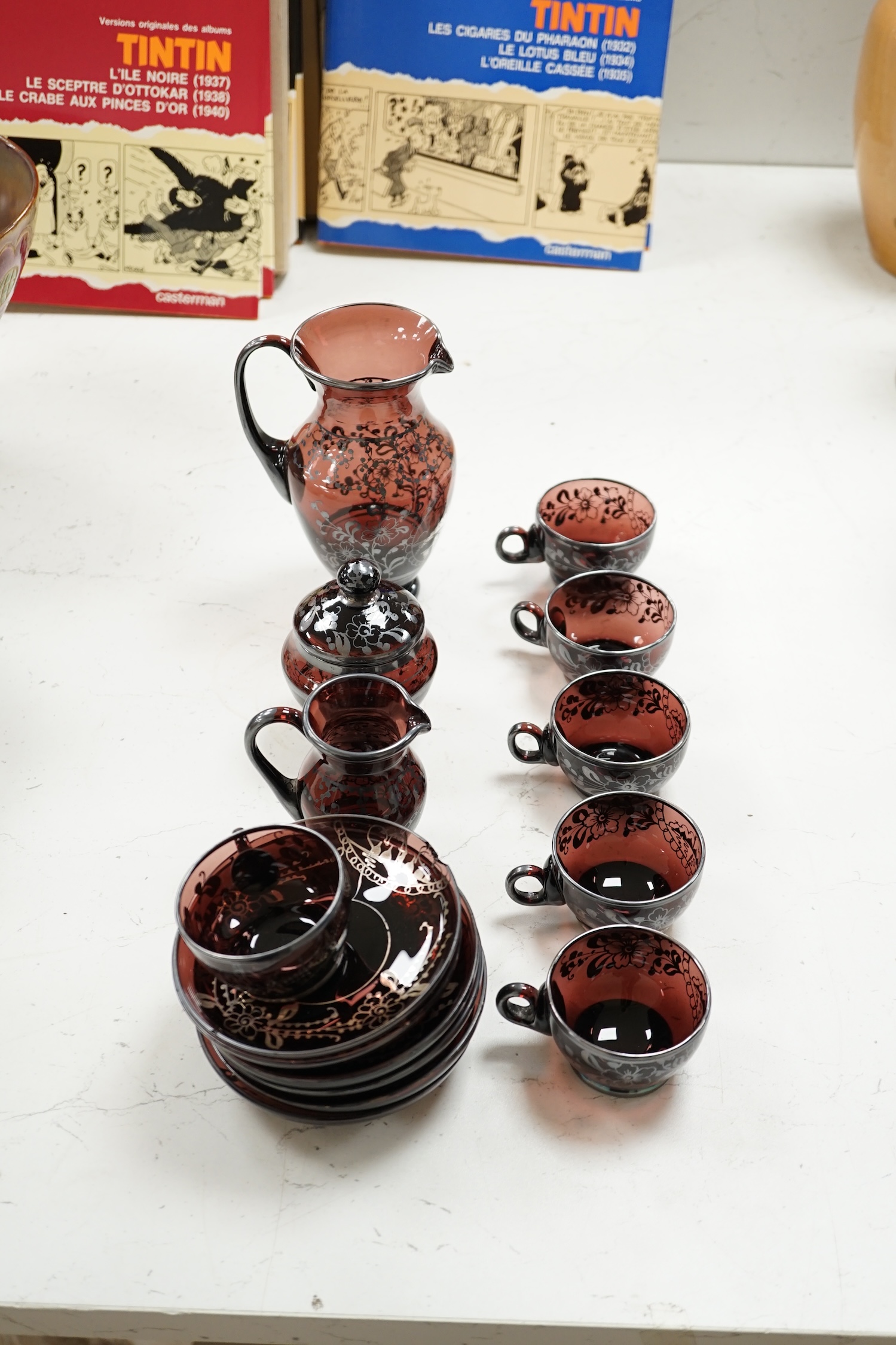 A Venetian amethyst glass tea set. Condition - some damage